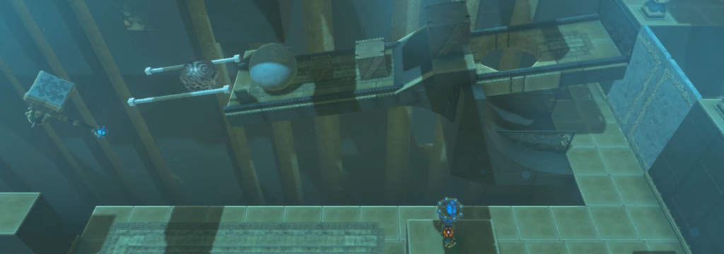 Link using the hammer to push the smaller ball to push the bigger one so it can break the door