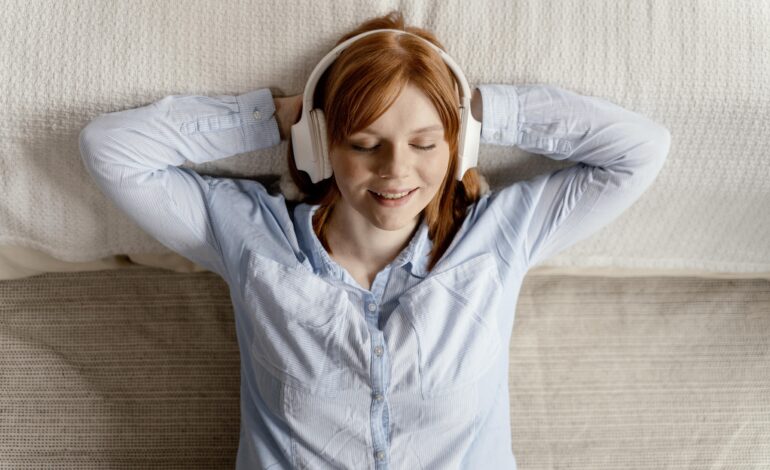 Woman listening to music with great noise cancelling headphones